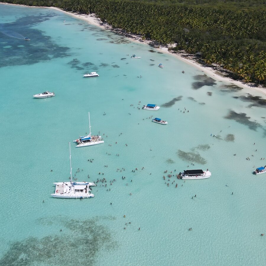 a group of boats floating on top of a body of water